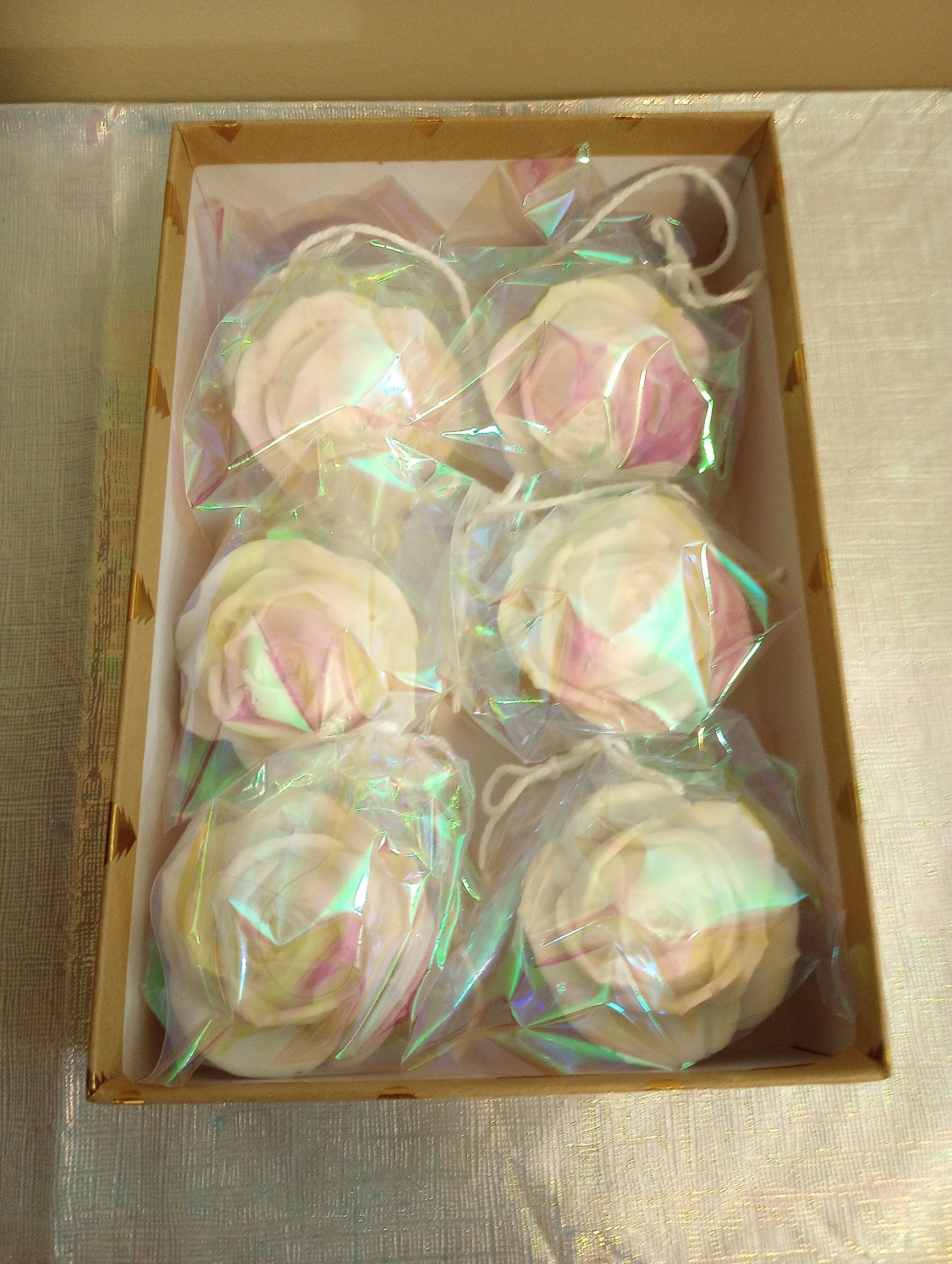Rose flower soaps displayed in elegant gift boxes for anniversary or baby shower gifts.