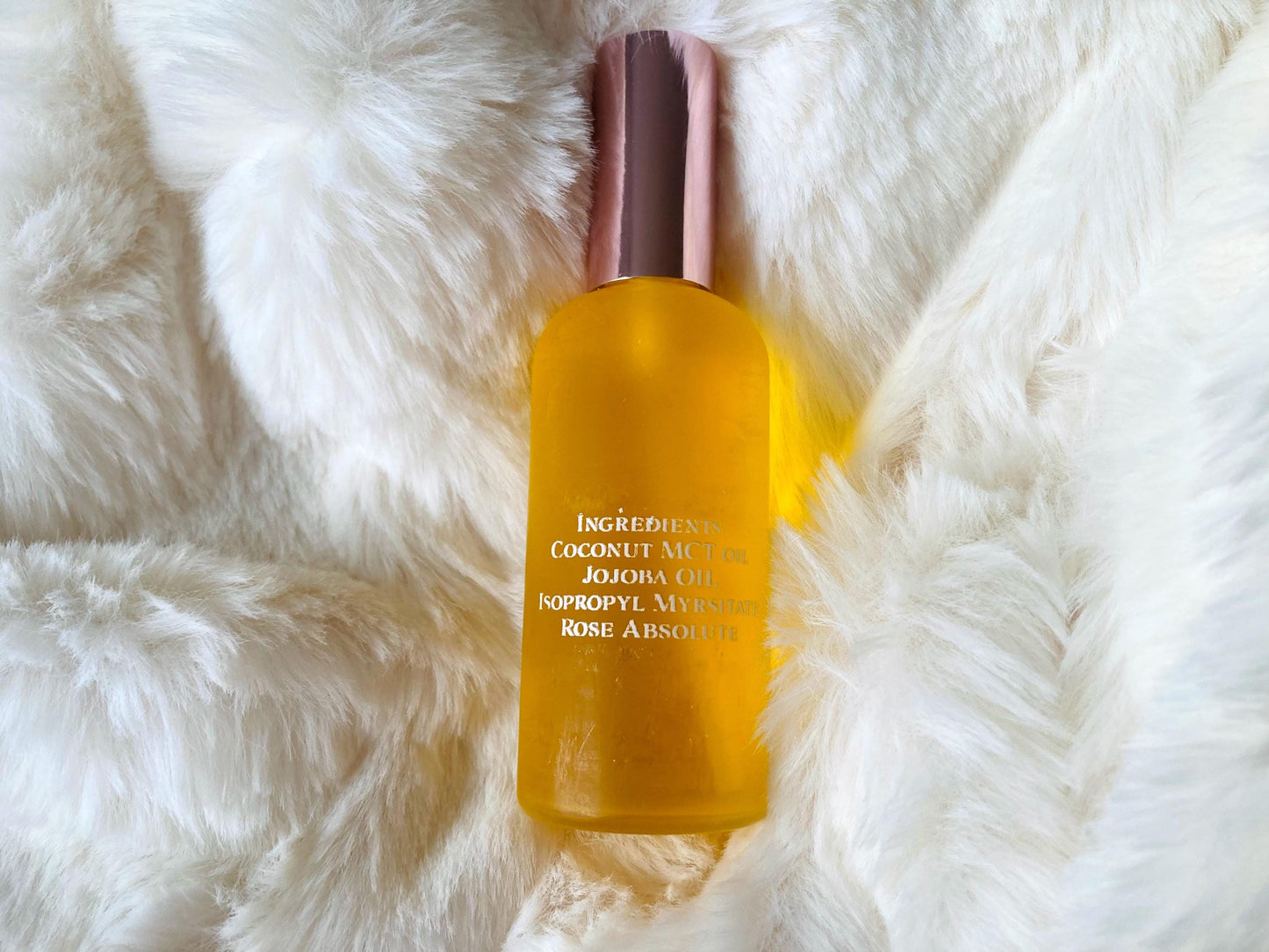 The ingredients of the Rose Absolute oil mist including Jojoba, MCT, and IPM.
